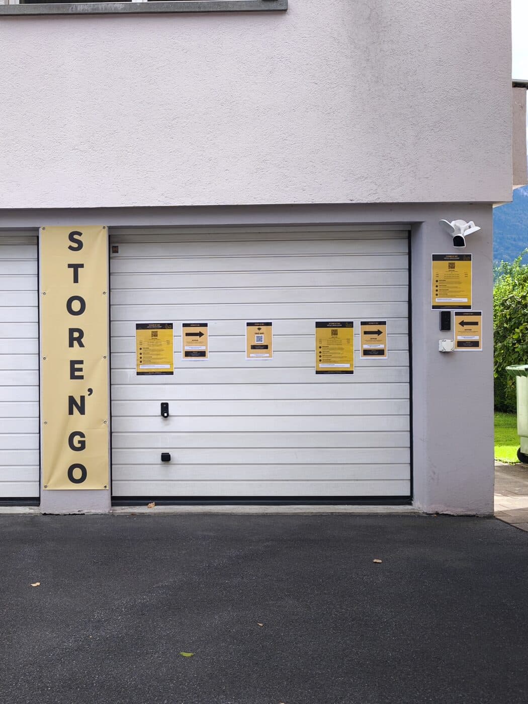 The door with banner, notice and keypad — that's how you recognise the entrance.